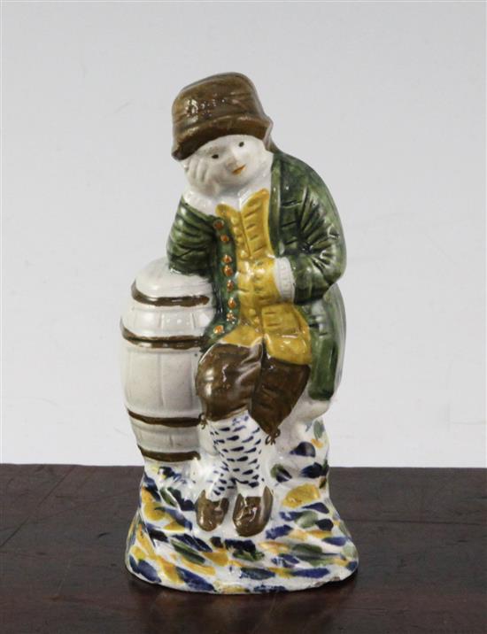 A Prattware figure of a young boy leaning on a barrel, late 18th century, 11.8cm